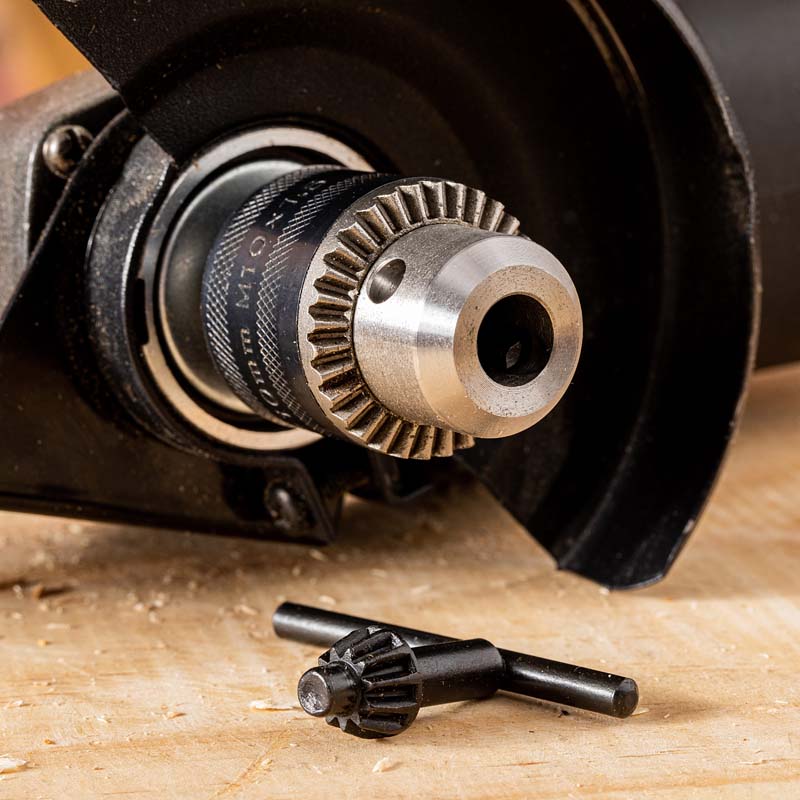 Drill chuck store for angle grinder